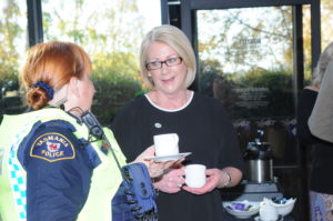 Senior Constable Sharee Smith (pictured in uniform) and Inspector Philippa Burk share conversation over a cup of tea at the 100 years Women In Policing High Tea on Saturday 3 June 2017.