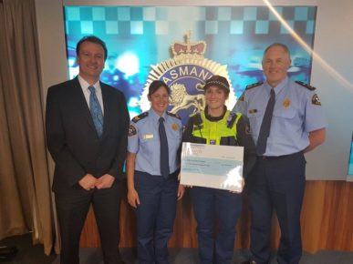Edmund Rice Camp Cheque Presentation by Constable Aletia Kube to Andrew Blackett CEO