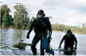 Constable Fiona Russell diving at Lake Kara as part of the Helen Munnings investigation (courtesy of The Examiner Newspaper)