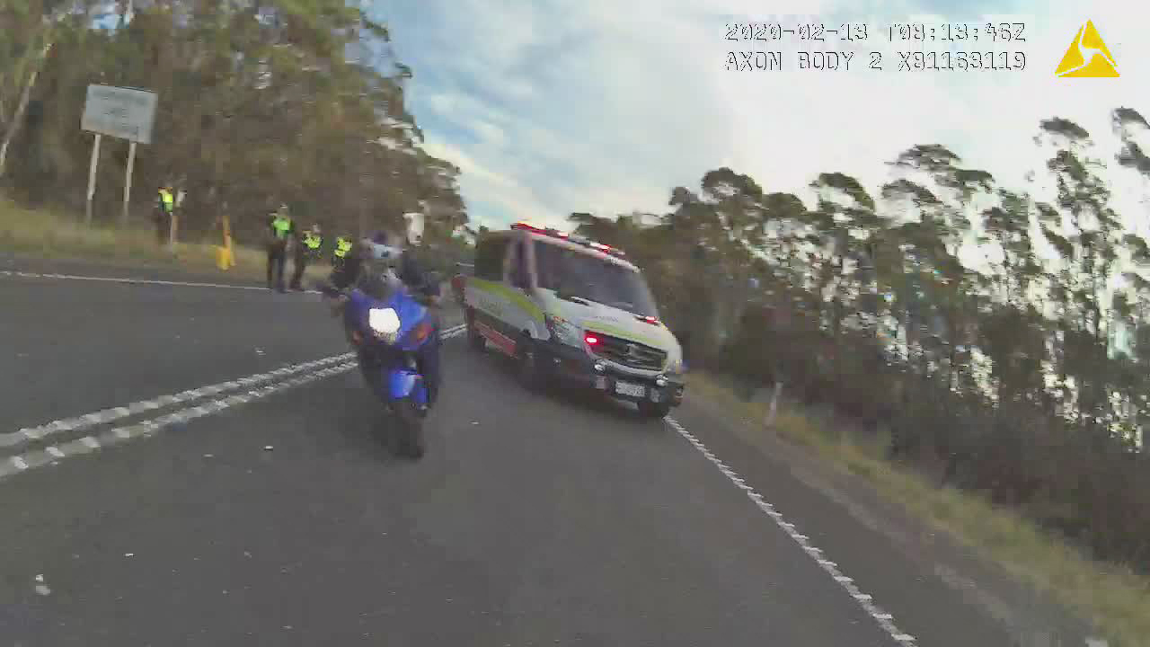 Motorbike dangerous driving through emergency scene